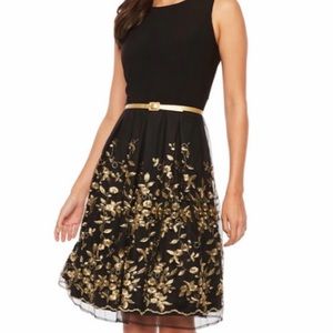 Size 14 black dress with gold embellishments.